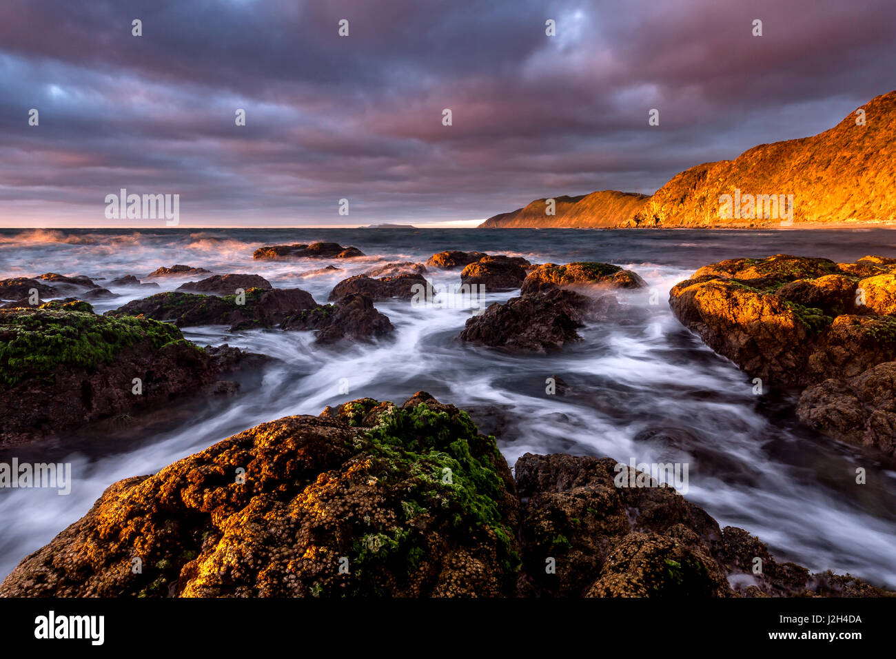 Makara Beach Sunset Banque D'Images