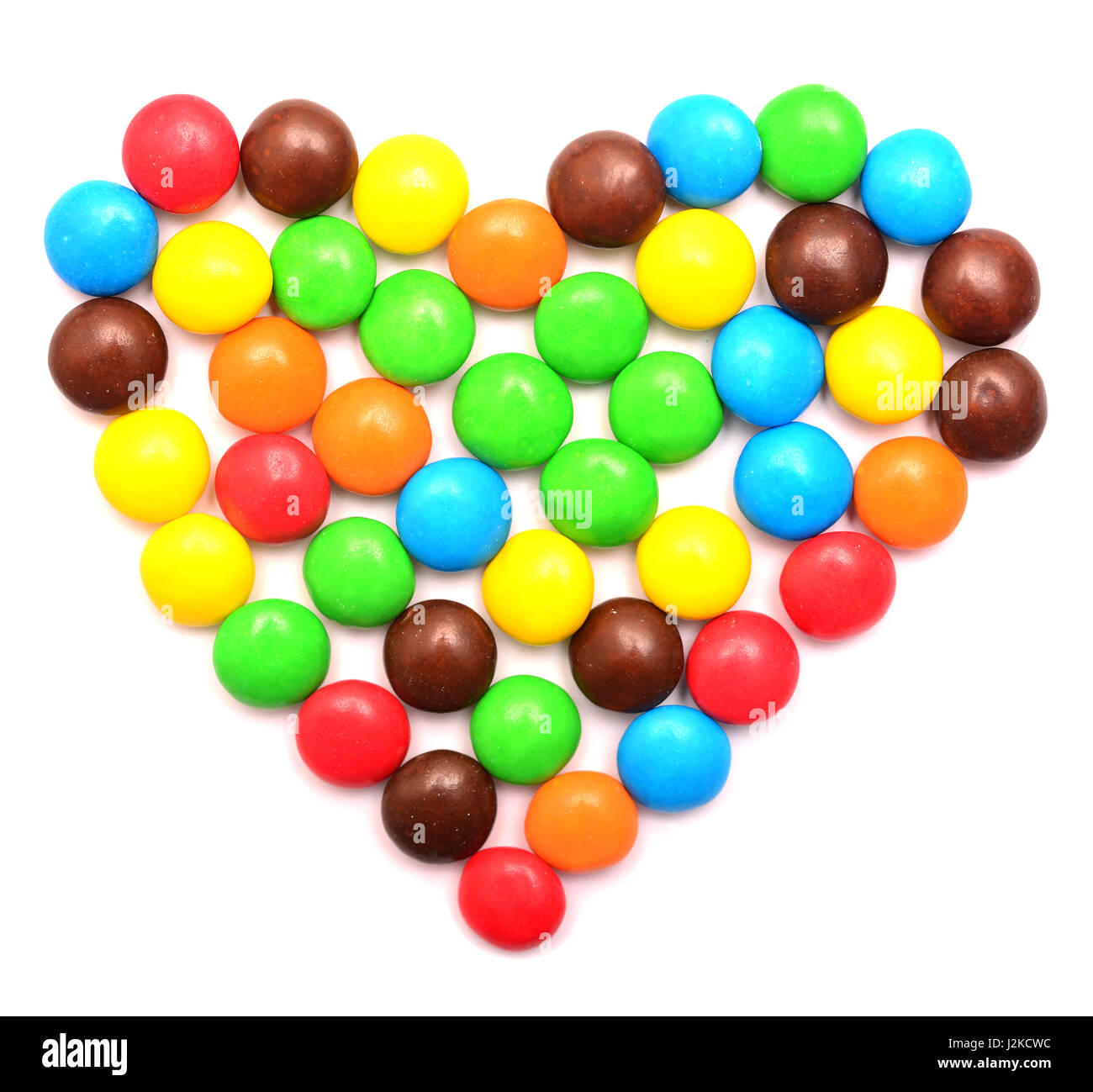 Coeur de bonbons multicolores sur fond blanc Banque D'Images