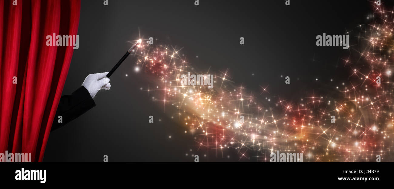 Magicien part avec Magic wand crée l'illusion Banque D'Images