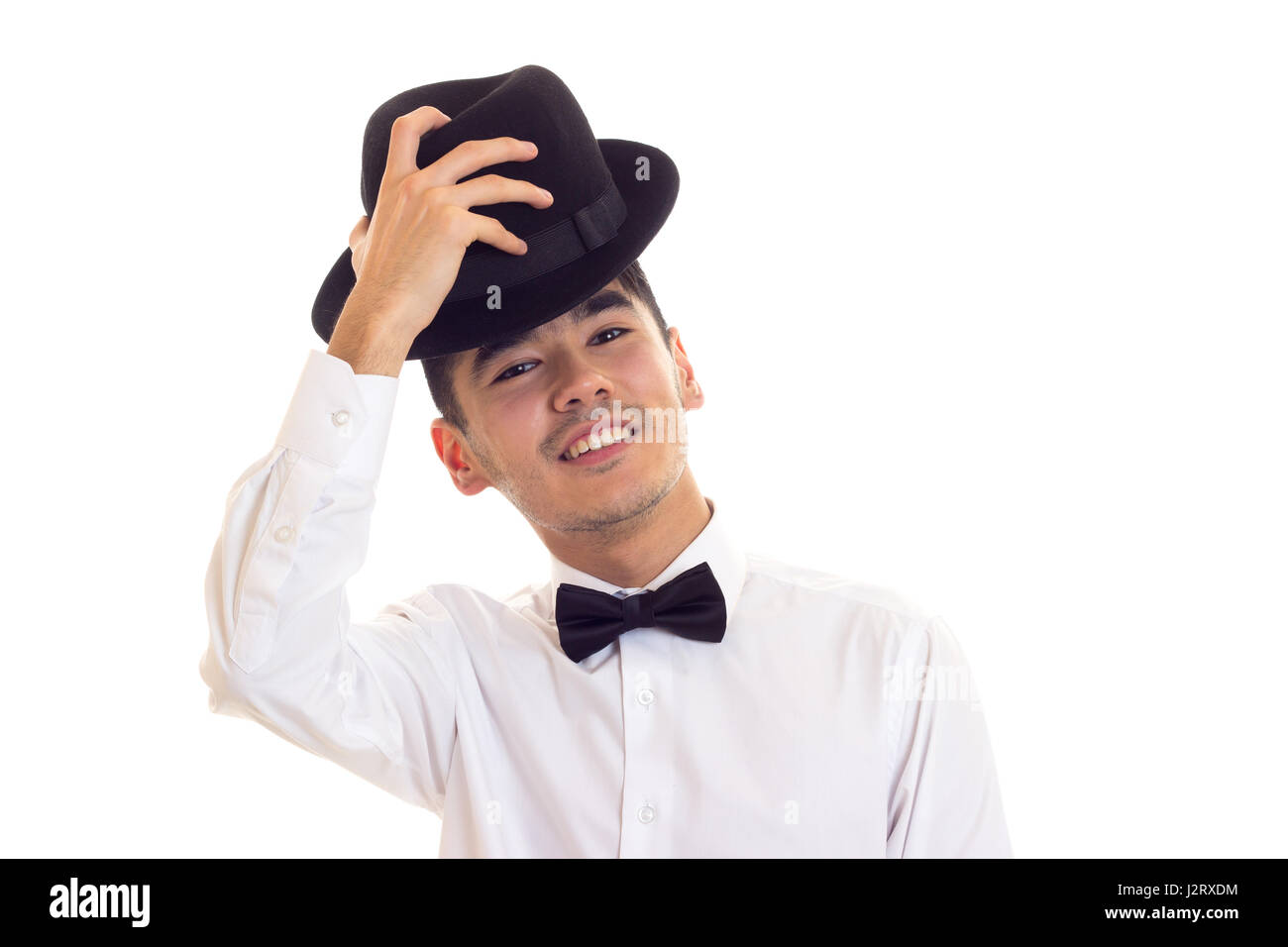 Jeune homme en T-shirt blanc avec chapeau noir Banque D'Images