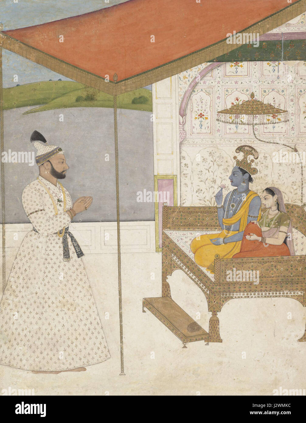 Cette œuvre, attribuée à Nainsukh de Jasrota, représente une scène de culte mettant en vedette le Seigneur Krishna et Radha. Nainsukh était connu pour ses peintures détaillées et émotives, explorant souvent des thèmes religieux et la vie courtoise au XVIIIe siècle. Banque D'Images
