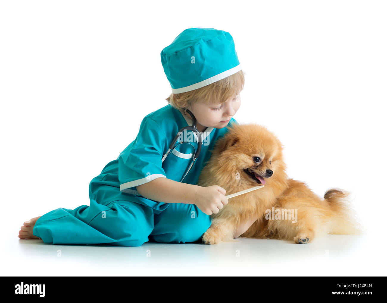 Vêtements pour enfants médecin vétérinaire jeu portés par... Banque D'Images
