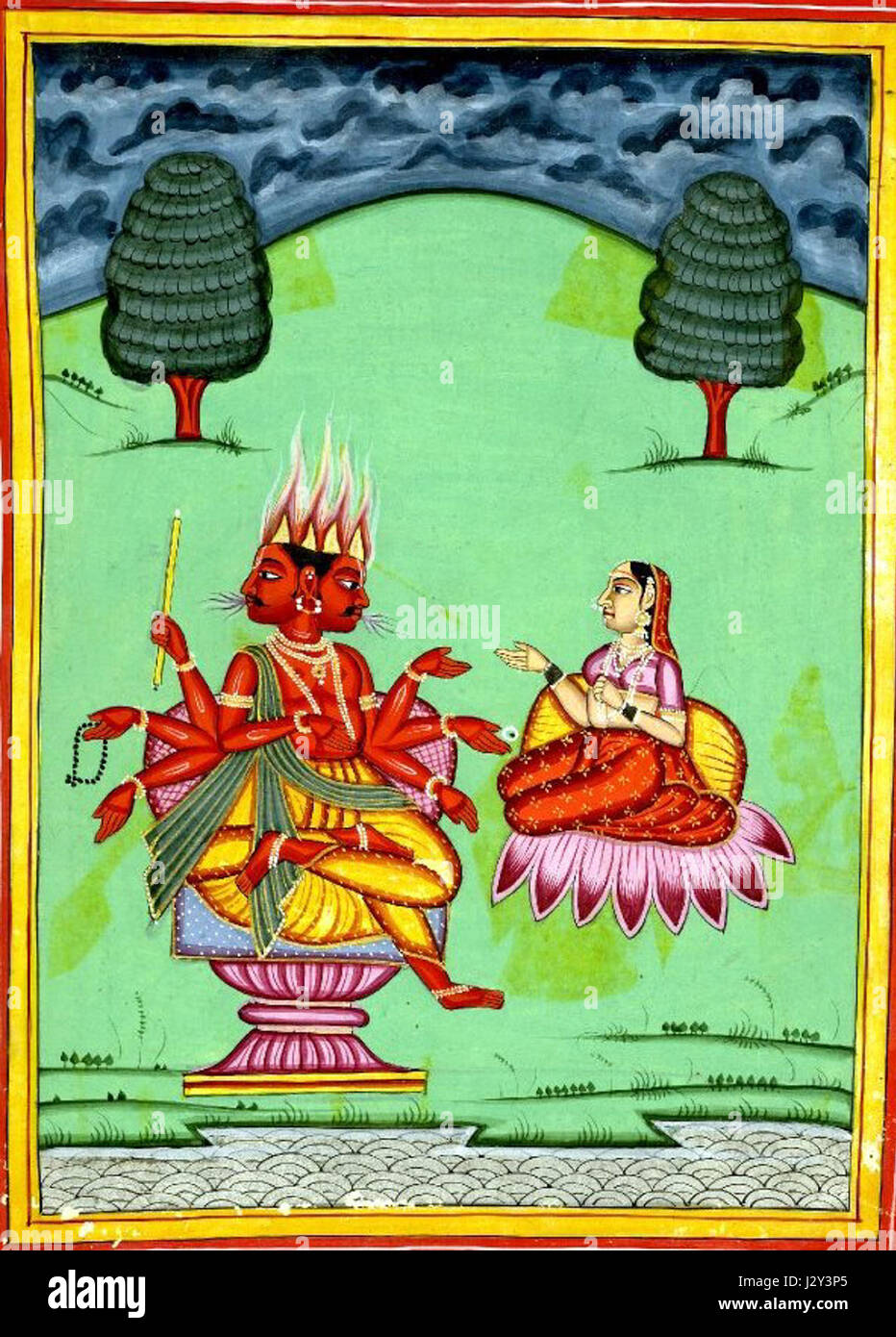 Représentation d'Agni, le Dieu hindou du feu, et de son épouse, mettant en valeur leurs rôles dans les rituels védiques et la mythologie hindoue. Banque D'Images