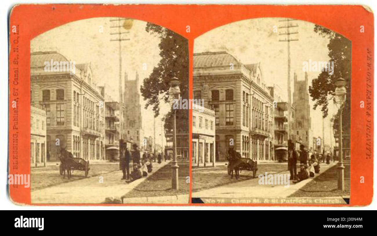 Une vue sur Camp Street à la Nouvelle-Orléans lors des célébrations de la fête de Patrick, mettant en valeur l'ambiance festive avec une chaîne stéréo et des bénédictions locales. Banque D'Images