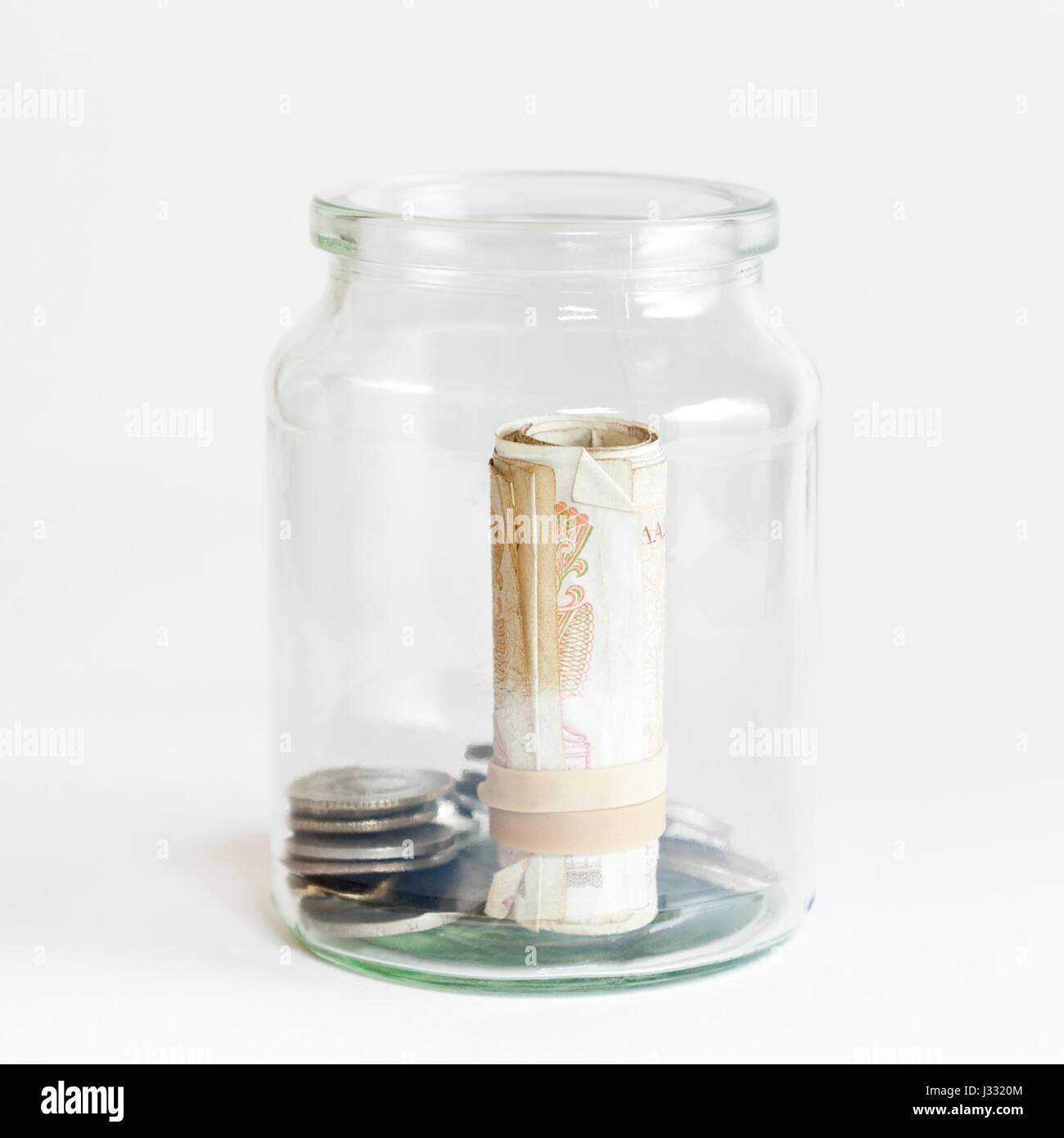Vieux grec de l'argent. Drachme billets et pièces enregistrées dans un bocal de verre Banque D'Images