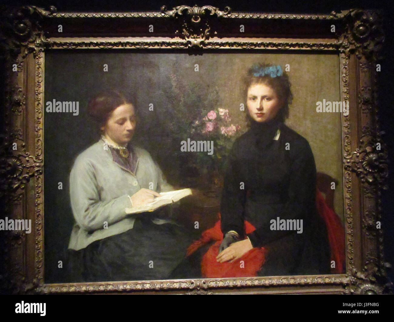 'La lecture' est une peinture de nature morte de Henri Fantin-Latour, achevée en 1870. Connu pour son habileté à dépeindre des scènes délicates et intimes, Fantin-Latour met en scène une femme lisant un livre. L'accent mis par l'artiste sur le détail et l'interaction de la lumière et de l'ombre souligne sa maîtrise à la fois du portrait et de la nature morte, avec une composition raffinée qui met l'accent sur les moments tranquilles de la vie quotidienne. Banque D'Images