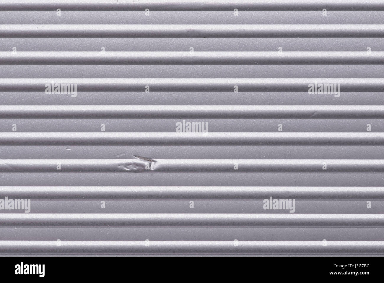 Surface métallique ondulé avec petite dent, l'orientation horizontale Banque D'Images