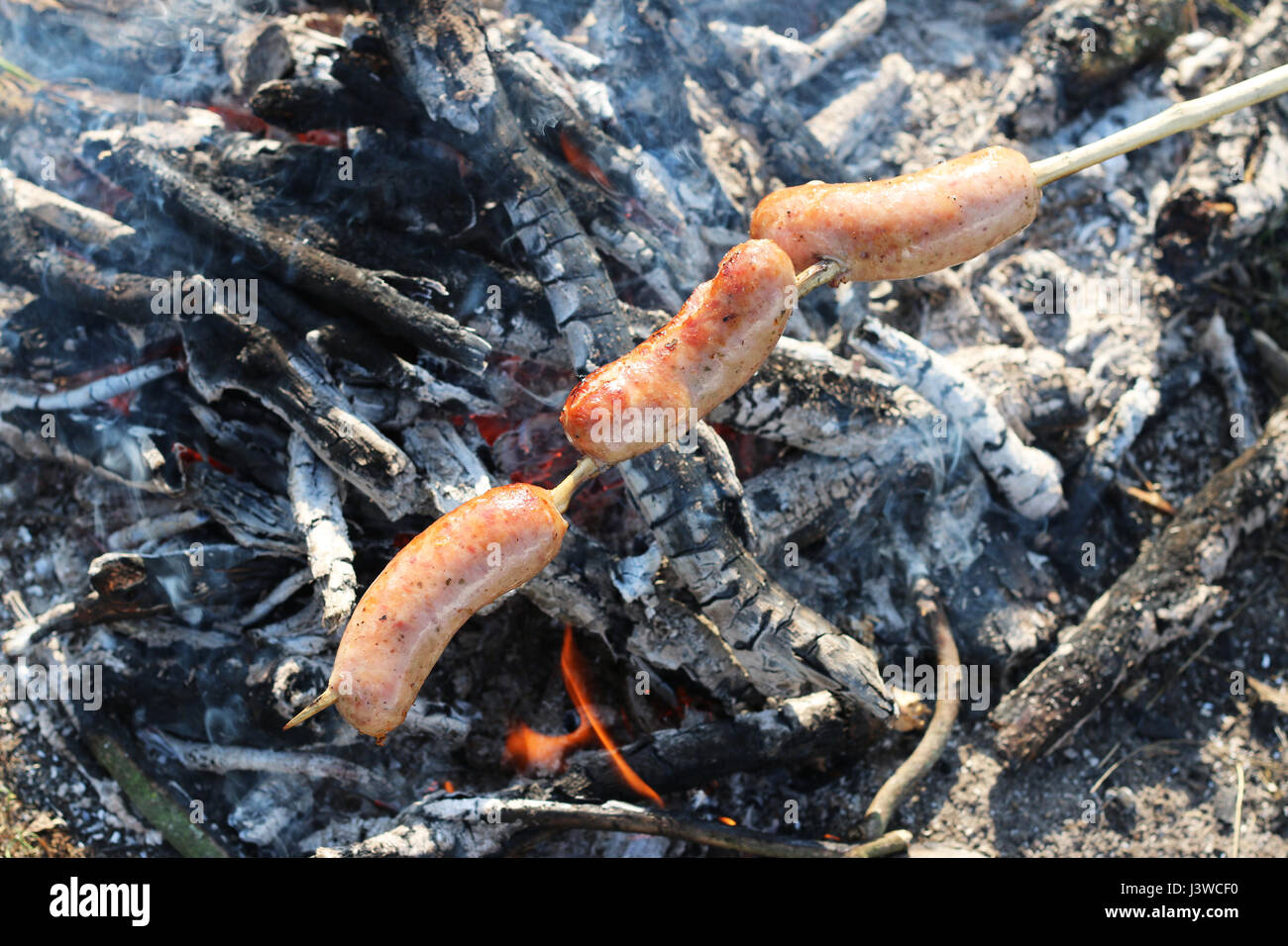 Fry sur feu saucisse trois Banque D'Images