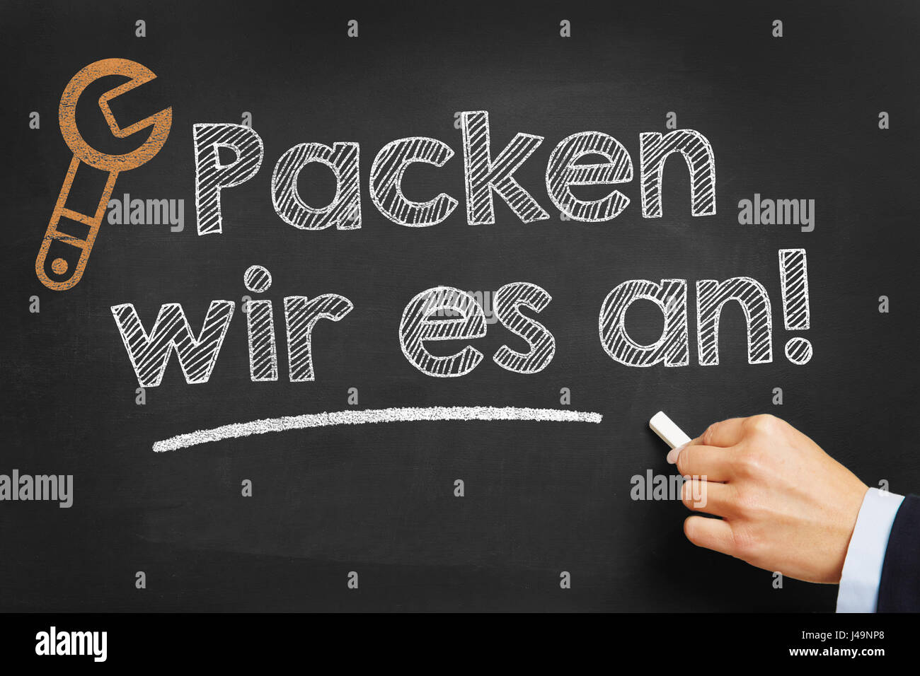Part écrit en allemand "Packen wir es un !" (nous l'abordons) que la motivation on chalkboard Banque D'Images