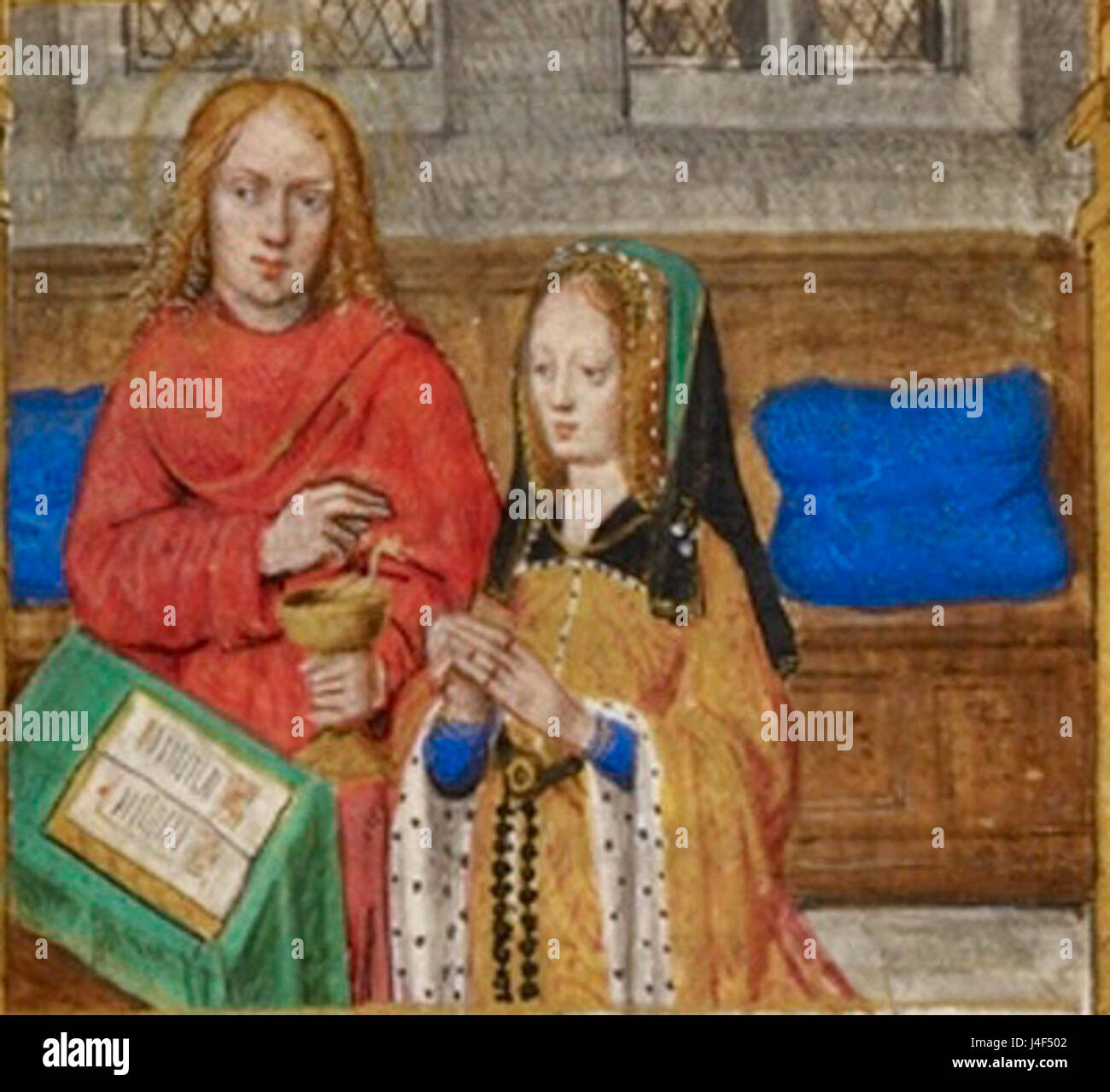 Cette image des heures de Jeanne de Castille montre la reine priant avec Saint Jean l'évangéliste, détail d'un manuscrit produit entre 1496 et 1506 à Bruges. Banque D'Images