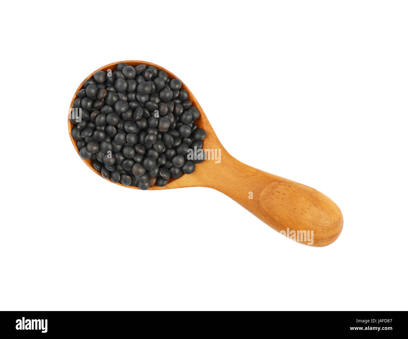 Lentille lentilles beluga noir en bois en écope isolé sur fond blanc, Close up, augmentation de la vue supérieure Banque D'Images