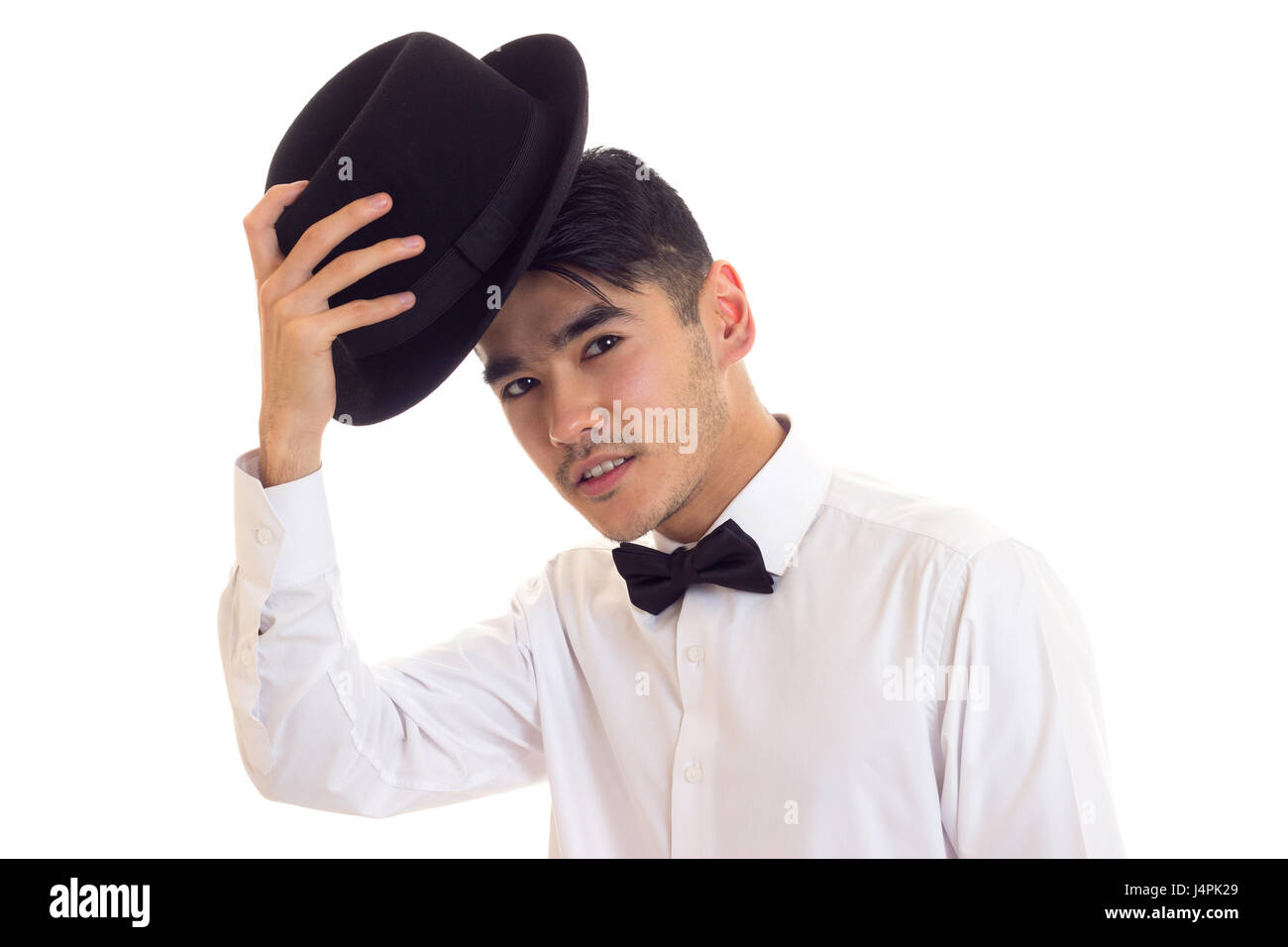 Jeune homme en T-shirt blanc avec chapeau noir Banque D'Images