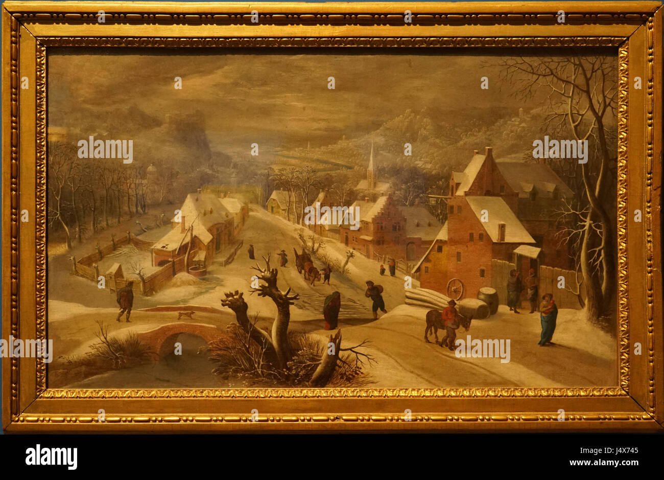 *Village sous la neige* de Mostaert le Vieux représente un village enneigé, capturant la sérénité et le calme d'un paysage hivernal en Europe du Nord. Banque D'Images