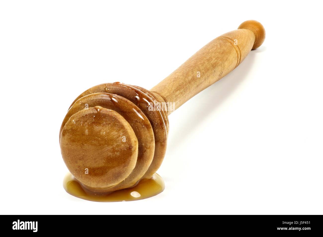 Cuillère de miel fait olivewood isolé sur fond blanc Banque D'Images