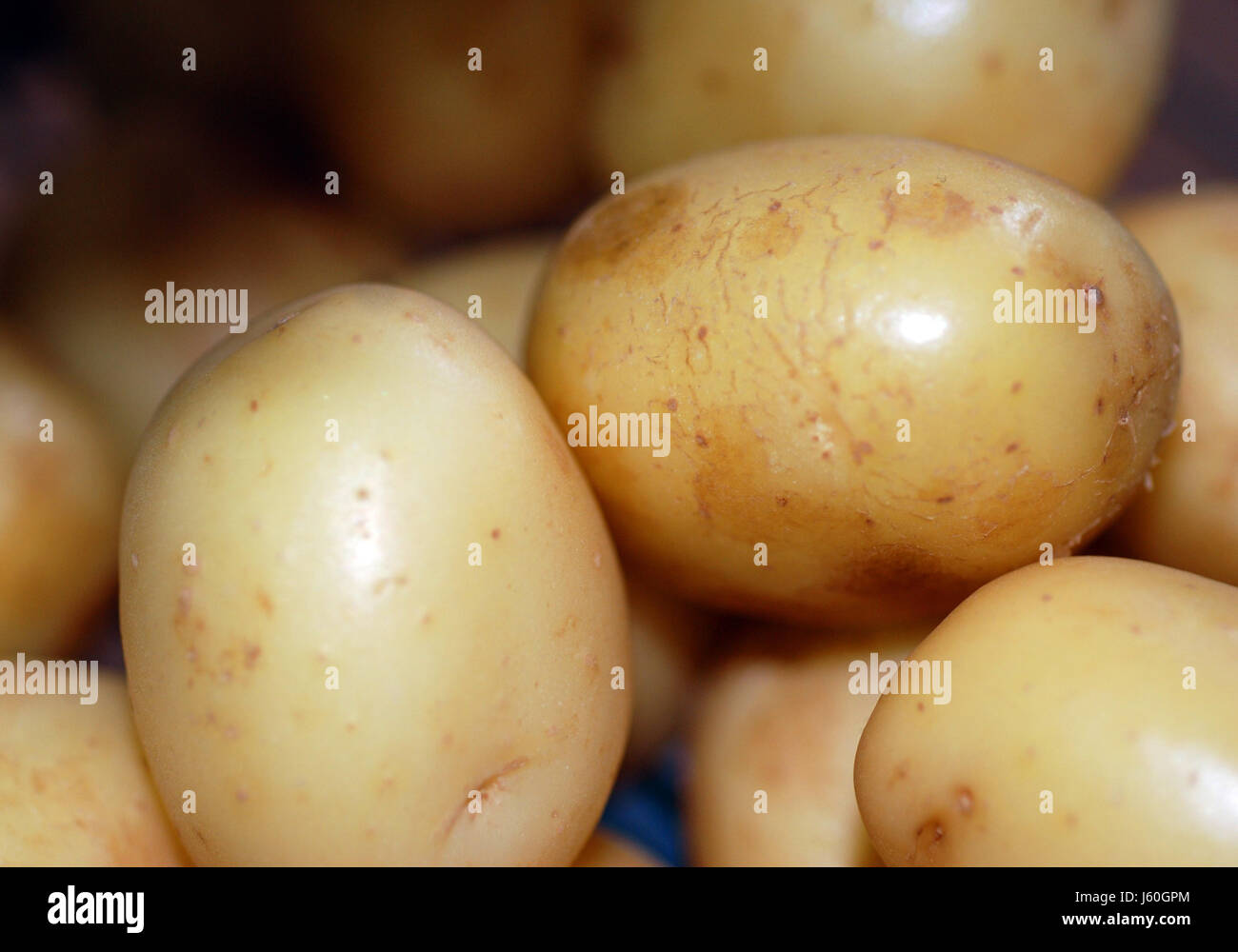 Aliment alimentaire pommes de terre nouvelles pommes de terre Fécule de pomme de spud glucides nutrition Banque D'Images