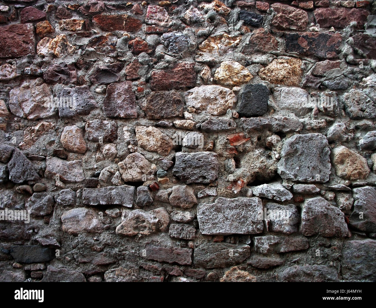 Mur de roche en pierre de style architecture construction solide de style architectural Banque D'Images