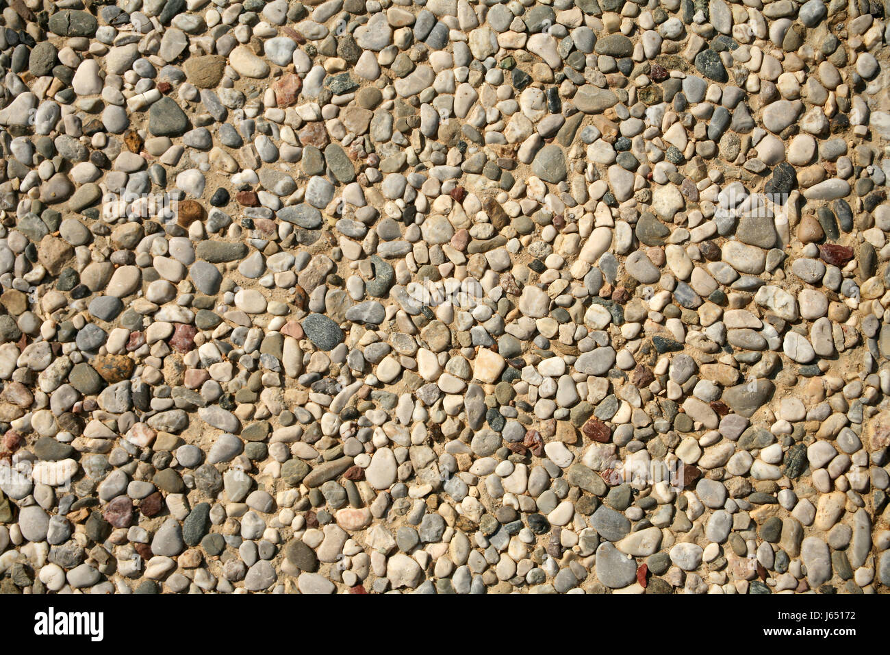 Galets de la côte des sables bitumineux solide sand texture macro macro close-up close up d'admission Banque D'Images
