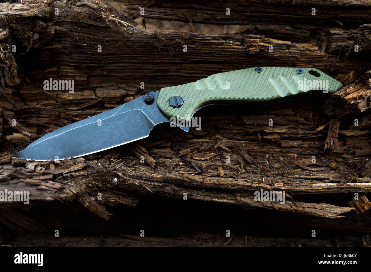 Couteau militaire avec greenn poignée. Banque D'Images