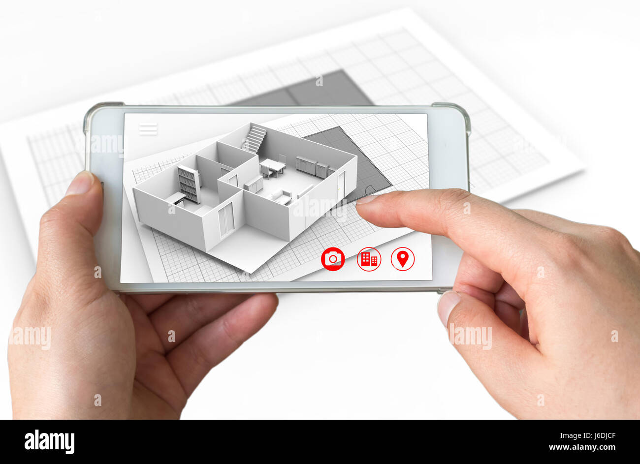 Concept de marketing de la réalité augmentée pour l'architecture. Hand holding smart phone avec AR pour simuler l'application popup 3d pièce interactive maps à la vie Banque D'Images