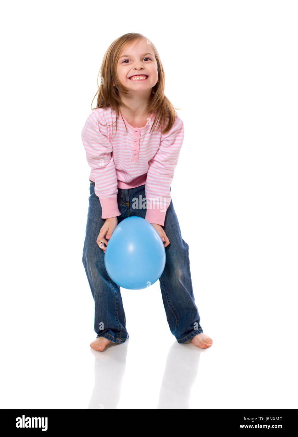 Little Girl Holding Balloon isolated on white Banque D'Images