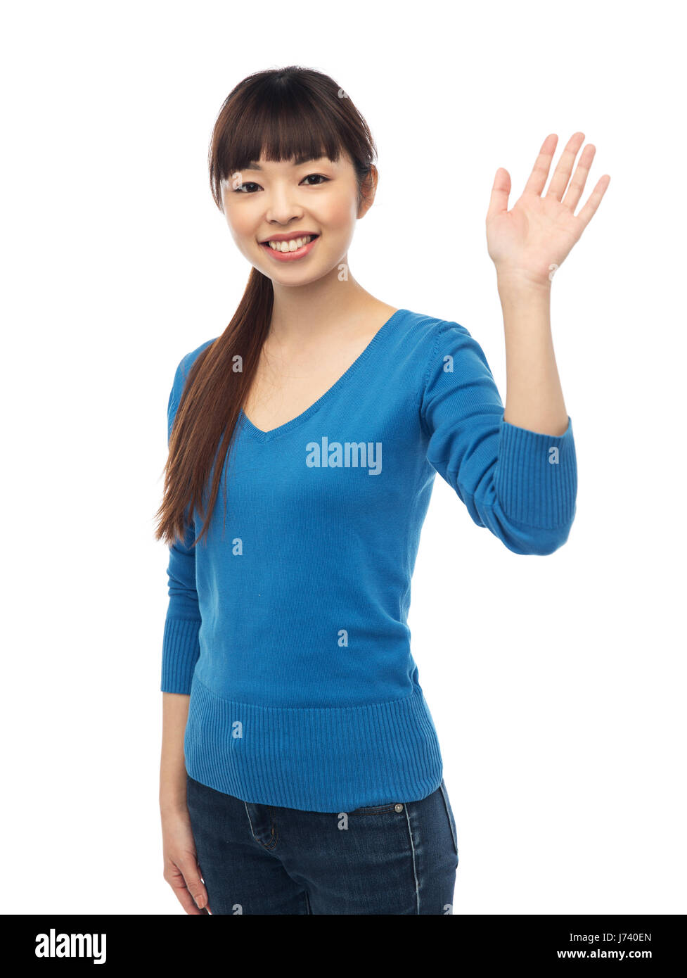 Happy smiling young woman waving hand over white Banque D'Images