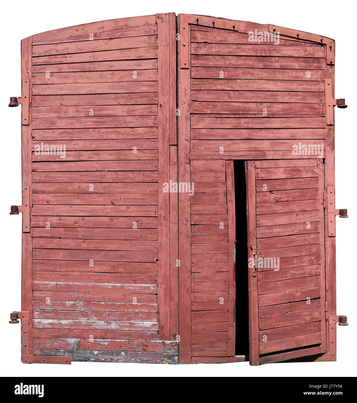 Les personnes âgées isolées de la porte rouge en bois ancienne rétro fire brigade shed. La petite porte est partiellement ouverte Banque D'Images
