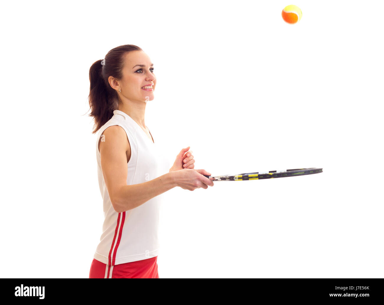 Femme jouant avec raquette de tennis Banque D'Images