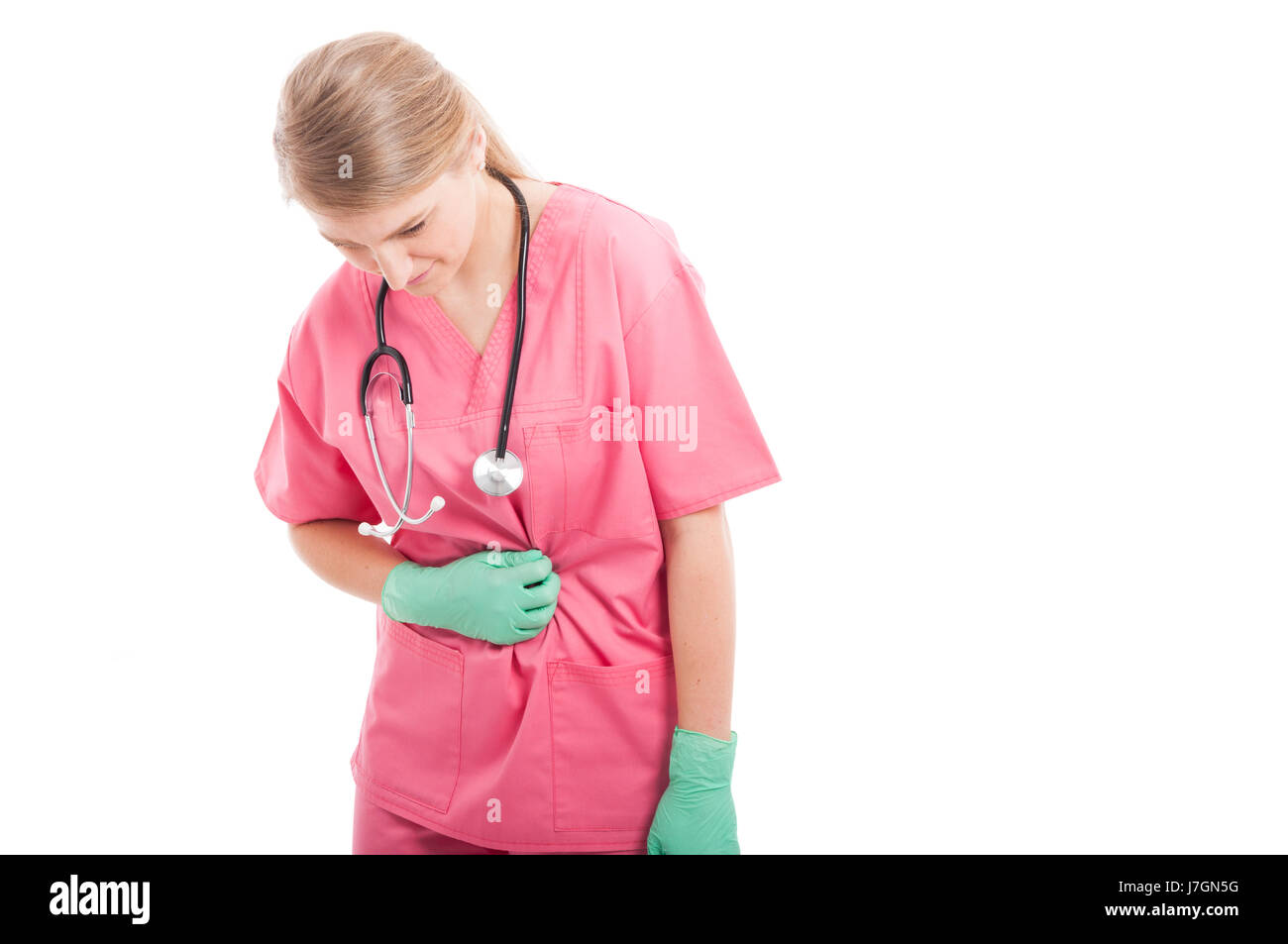 Infirmière tenant son estomac comme mal isolé sur fond blanc avec l'espace texte copie Banque D'Images