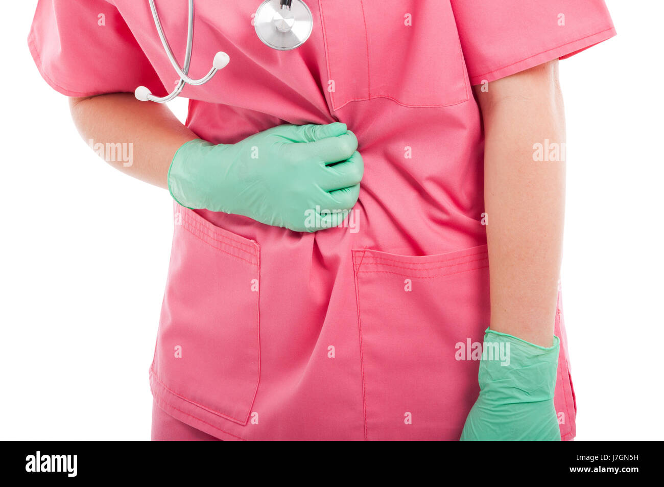 Close-up of nurse holding son estomac comme mal isolé sur fond blanc Banque D'Images