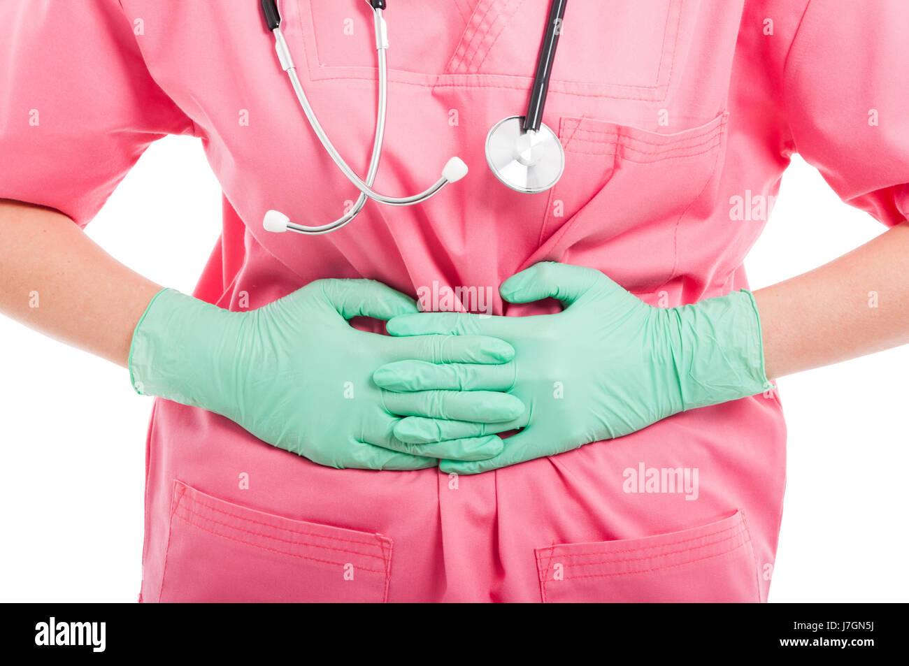 Close-up of nurse holding son estomac comme mal isolé sur fond blanc Banque D'Images