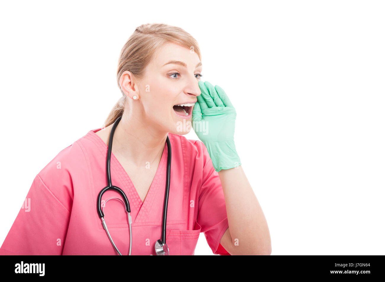 Female medical nurse wearing scrubs criant à haute voix isolé sur fond blanc avec l'espace texte copie Banque D'Images