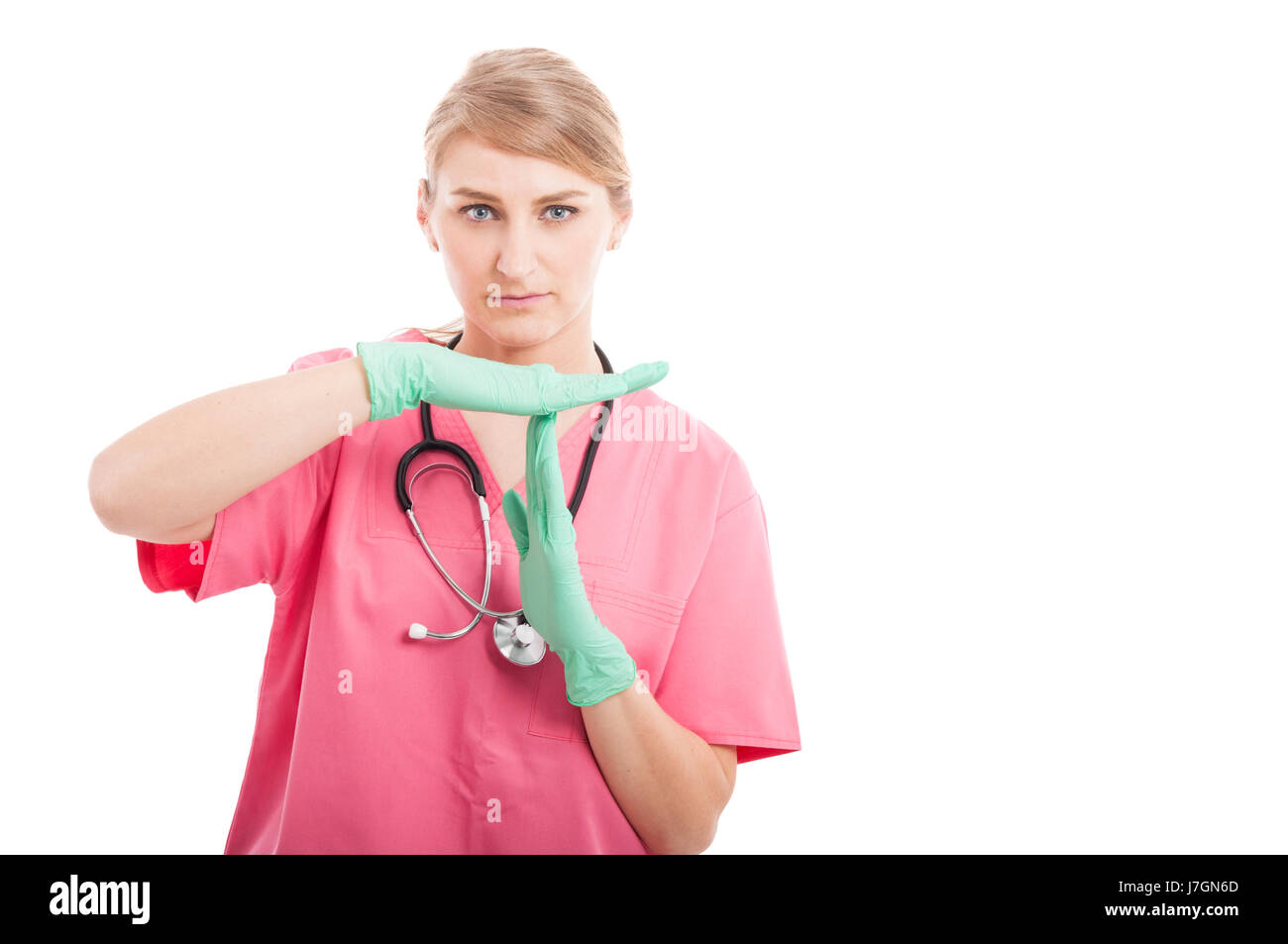 Infirmière Médicale féminine faisant geste de temps isolé sur fond blanc avec l'espace texte copie Banque D'Images