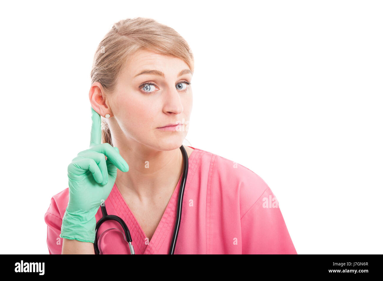 Femme séduisante infirmière médicale montrant l'écoute geste isolé sur fond blanc avec l'espace texte copie Banque D'Images