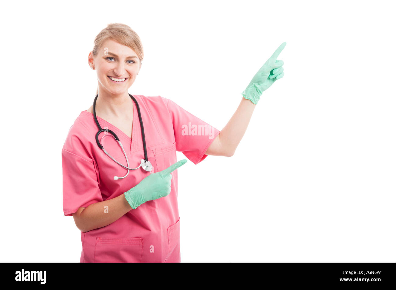 Belle Dame infirmière médicale et pointage copyspace isolé sur fond blanc avec l'espace texte copie Banque D'Images