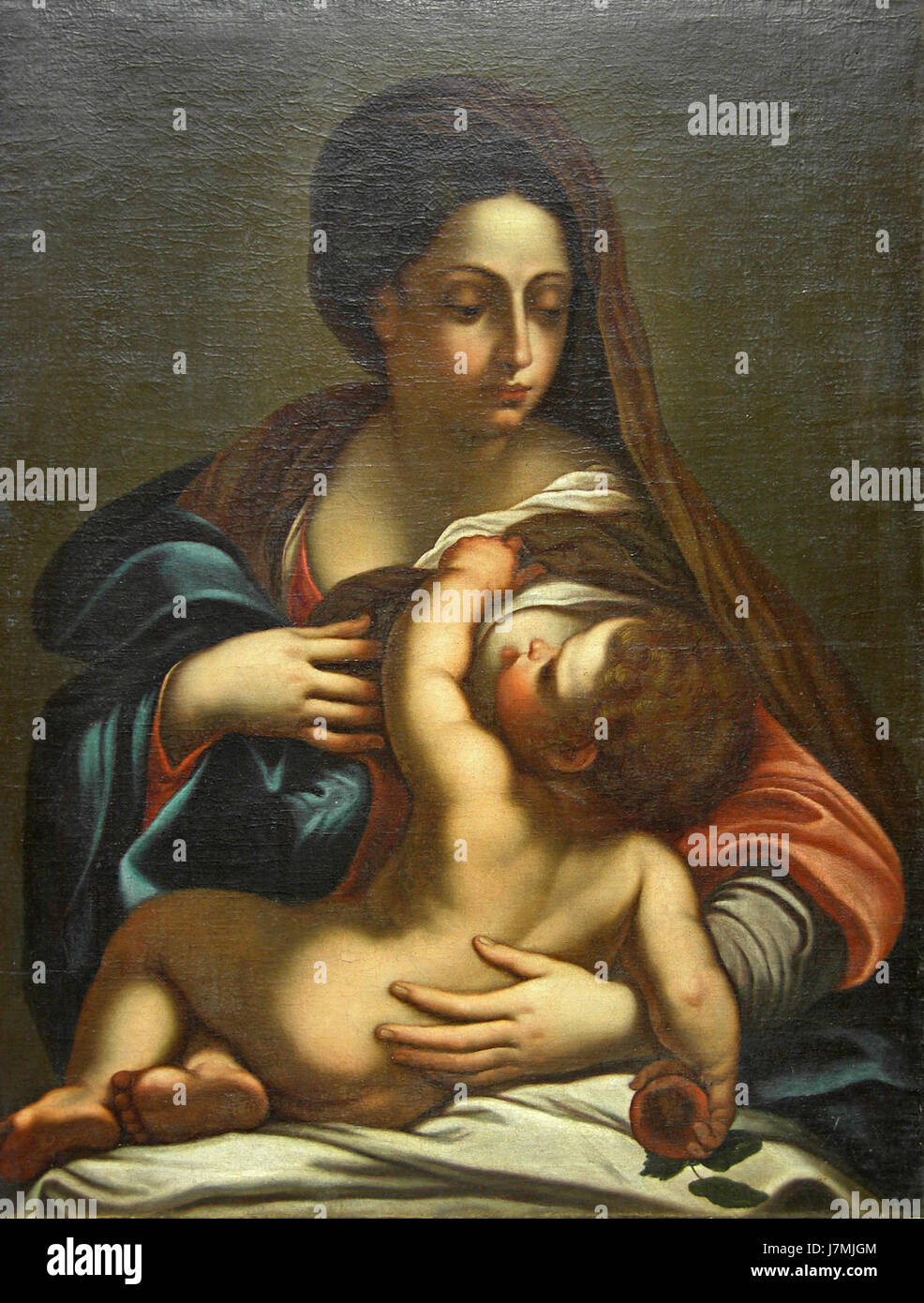 'Virgin Mary with Child' d'Annibale Carracci est une peinture baroque classique représentant la Vierge Marie tenant l'enfant Jésus. L'œuvre illustre la maîtrise de Carracci dans la création d'images tendres et religieuses pendant la période baroque. Banque D'Images