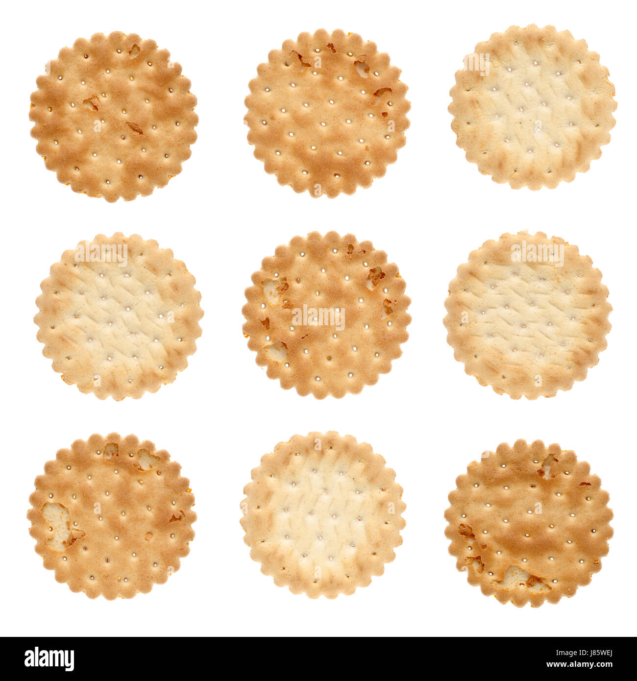 Sel pain doré isolé des trous carrés plat de biscuit apéritif déjeuner repas Banque D'Images