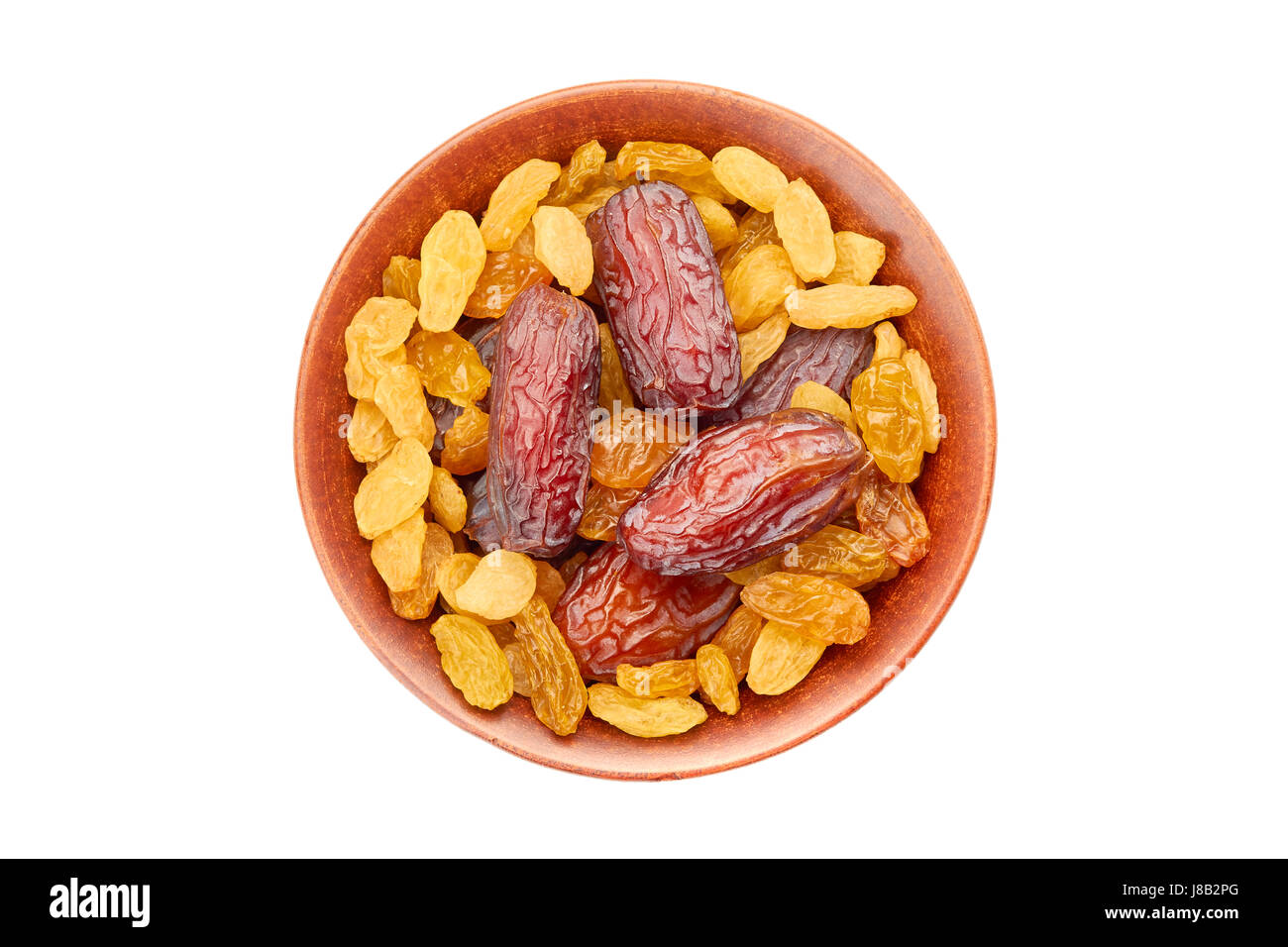 Bol de raisins et fruits date on white Banque D'Images