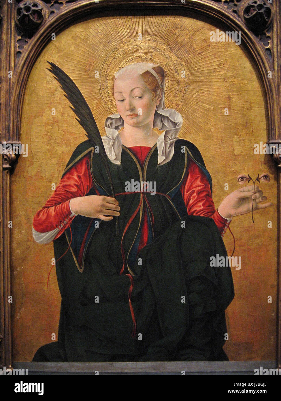 La peinture de Francesco del Cossa 'Sainte Lucy' est un exemple significatif de l'art de la Renaissance, mettant en valeur la représentation emblématique de Sainte Lucy avec des détails vifs et des éléments symboliques typiques des œuvres d'art religieuses de l'époque. Banque D'Images