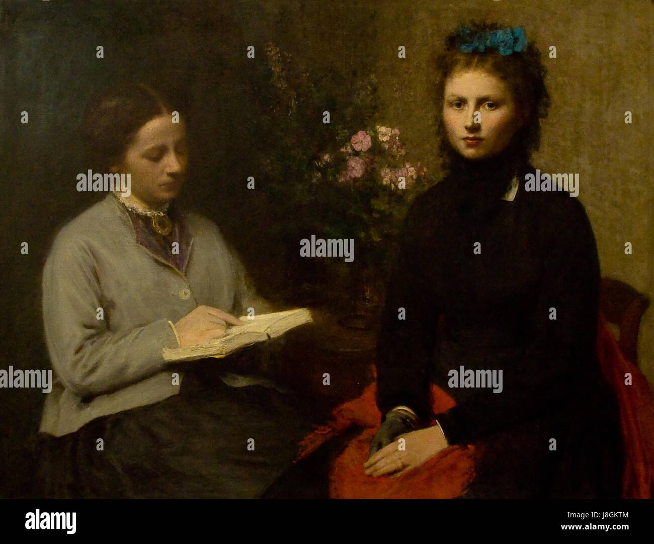 'Het lezen' (1870) de Henri Fantin-Latour est une peinture renommée mettant en vedette une femme lisant. Cette œuvre, installée dans le Museu Calouste Gulbenkian à Lisbonne, reflète l'attention de l'artiste sur des scènes intimes et quotidiennes. Banque D'Images