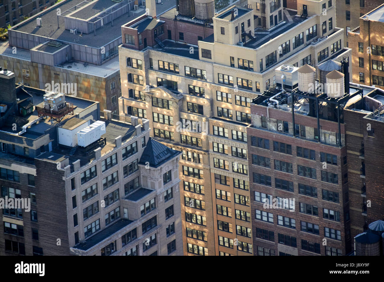 La lumière du soleil qui se reflète sur les fenêtres du bâtiment à Chelsea Manhattan New York USA Banque D'Images