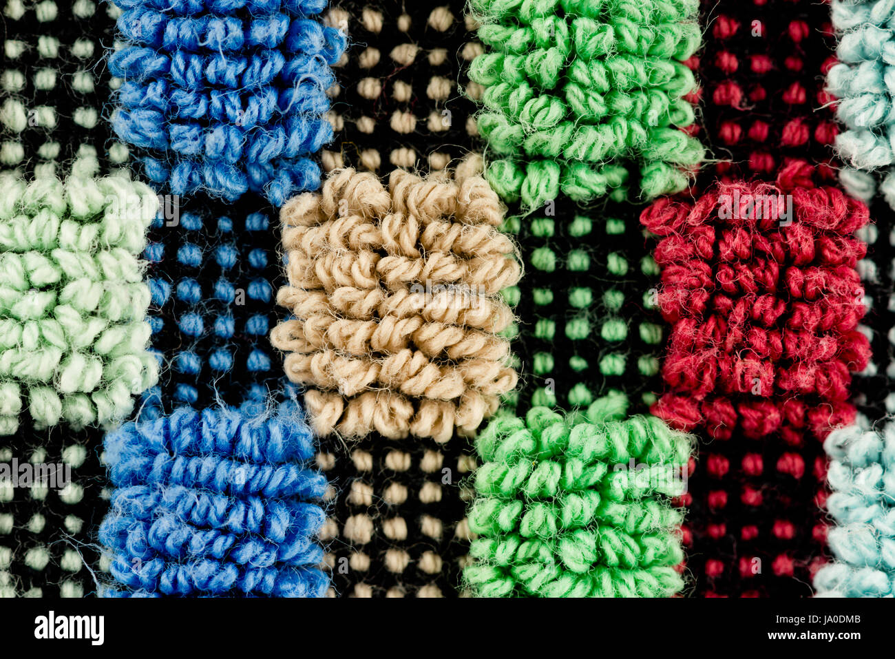Close-up of a multi colored fabric pattern structuré détaillées Banque D'Images