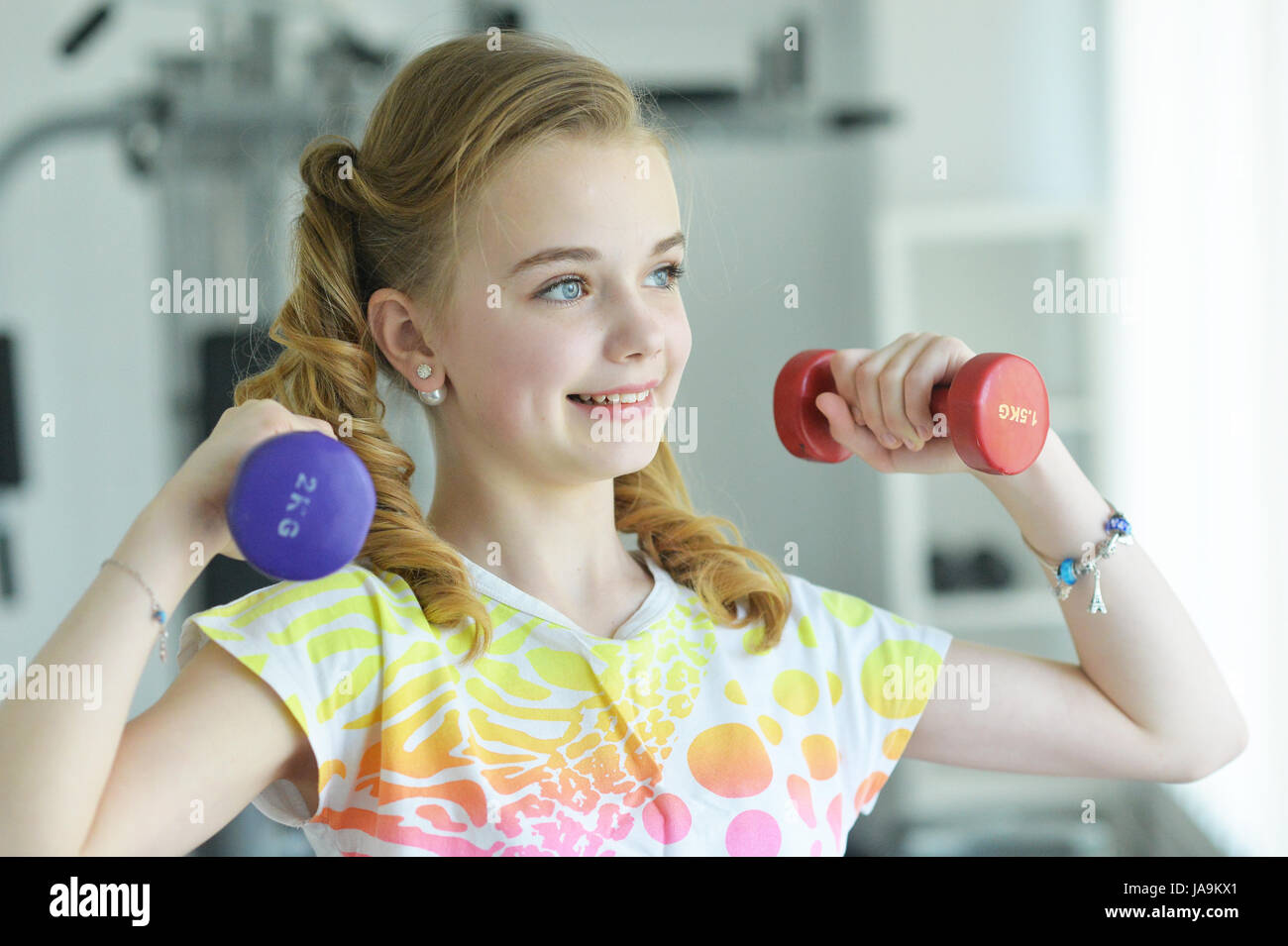 Cute little girl doing exercises Photo Stock - Alamy