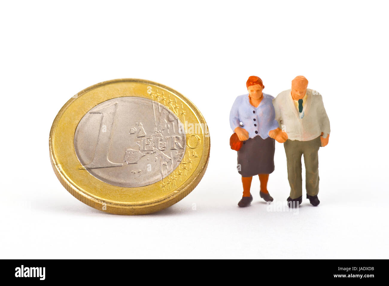 Von Mlodellfiguren Seniorenpaar Euromünze auf mit hellem Hintergrund Banque D'Images