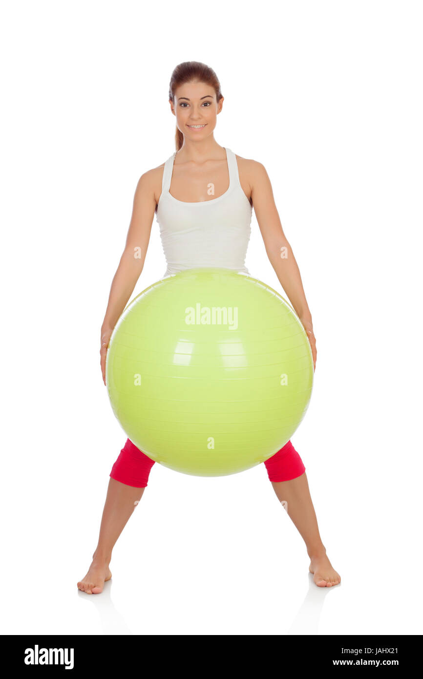 Jolie femme faire pilates avec un gros ballon vert isolé Photo Stock - Alamy