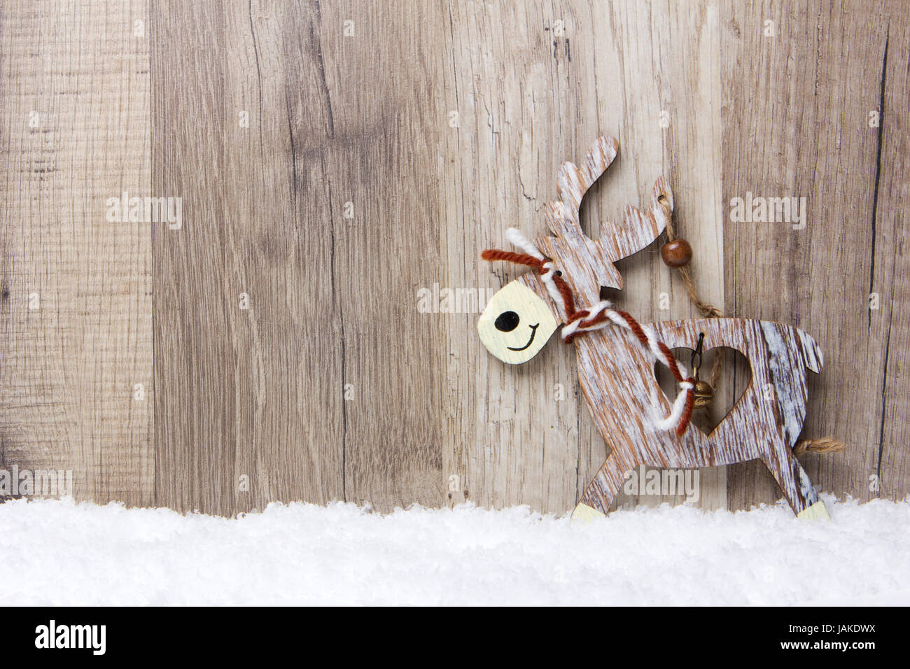 Weihnachten, Dekoration, Holzhintergrund mit Schnee, Elch Banque D'Images