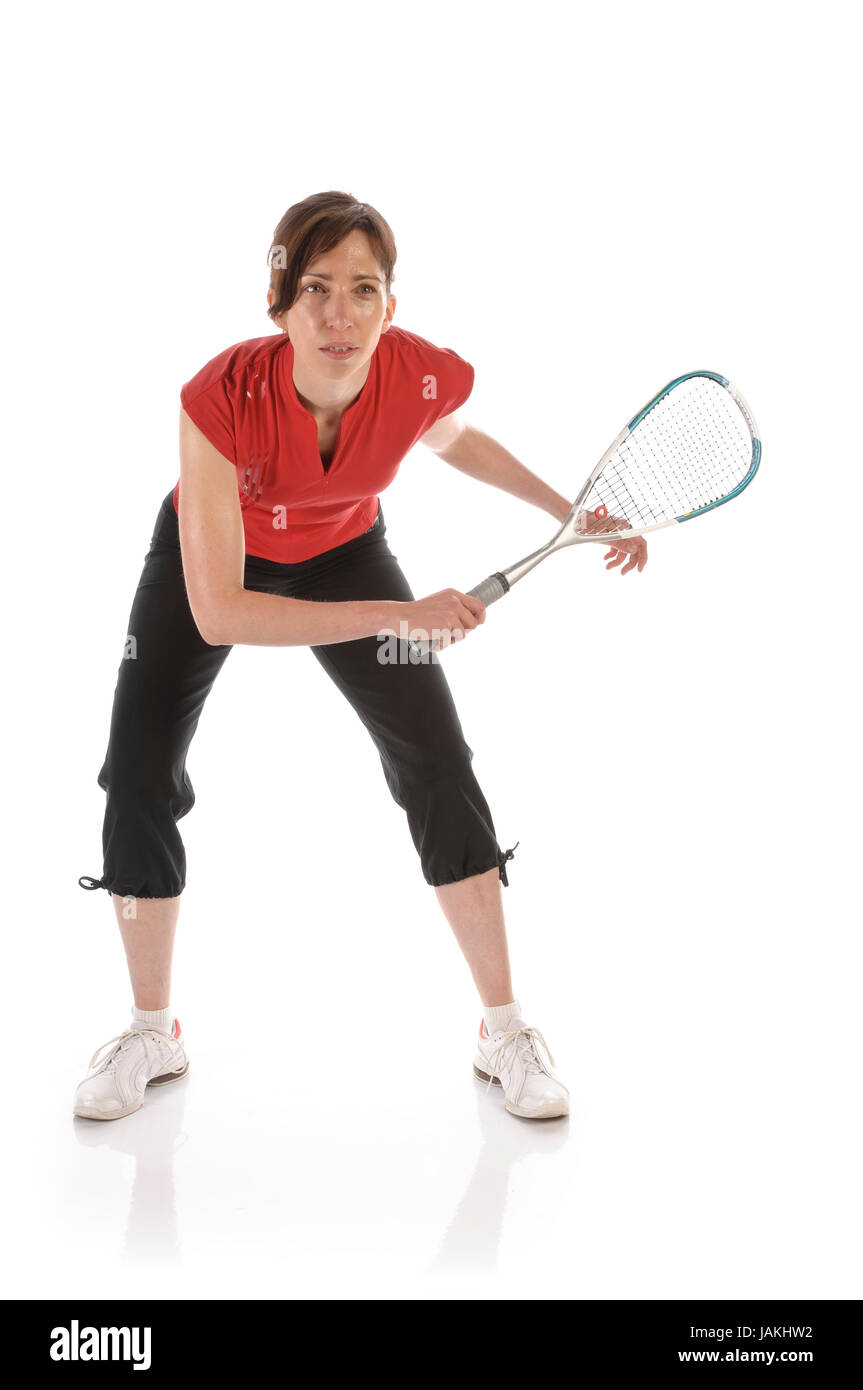 Erwachsene Frau dans Sportkleidung spielt Squash vor weißem Hintergrund Banque D'Images