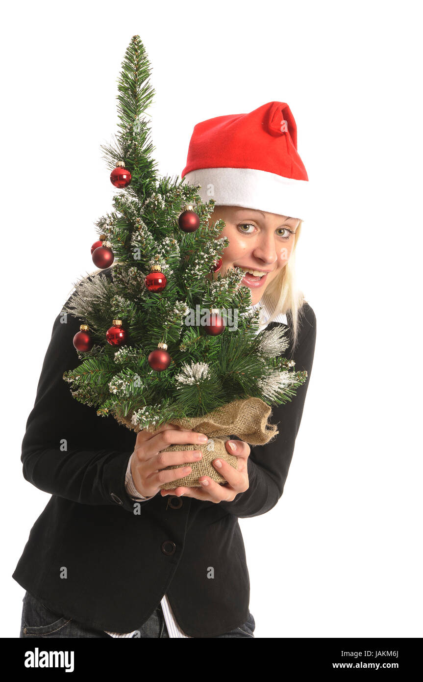 Hübsche blonde junge Frau mit Weihnachtsbaum vor und Geschenken weißem Hintergrund Banque D'Images