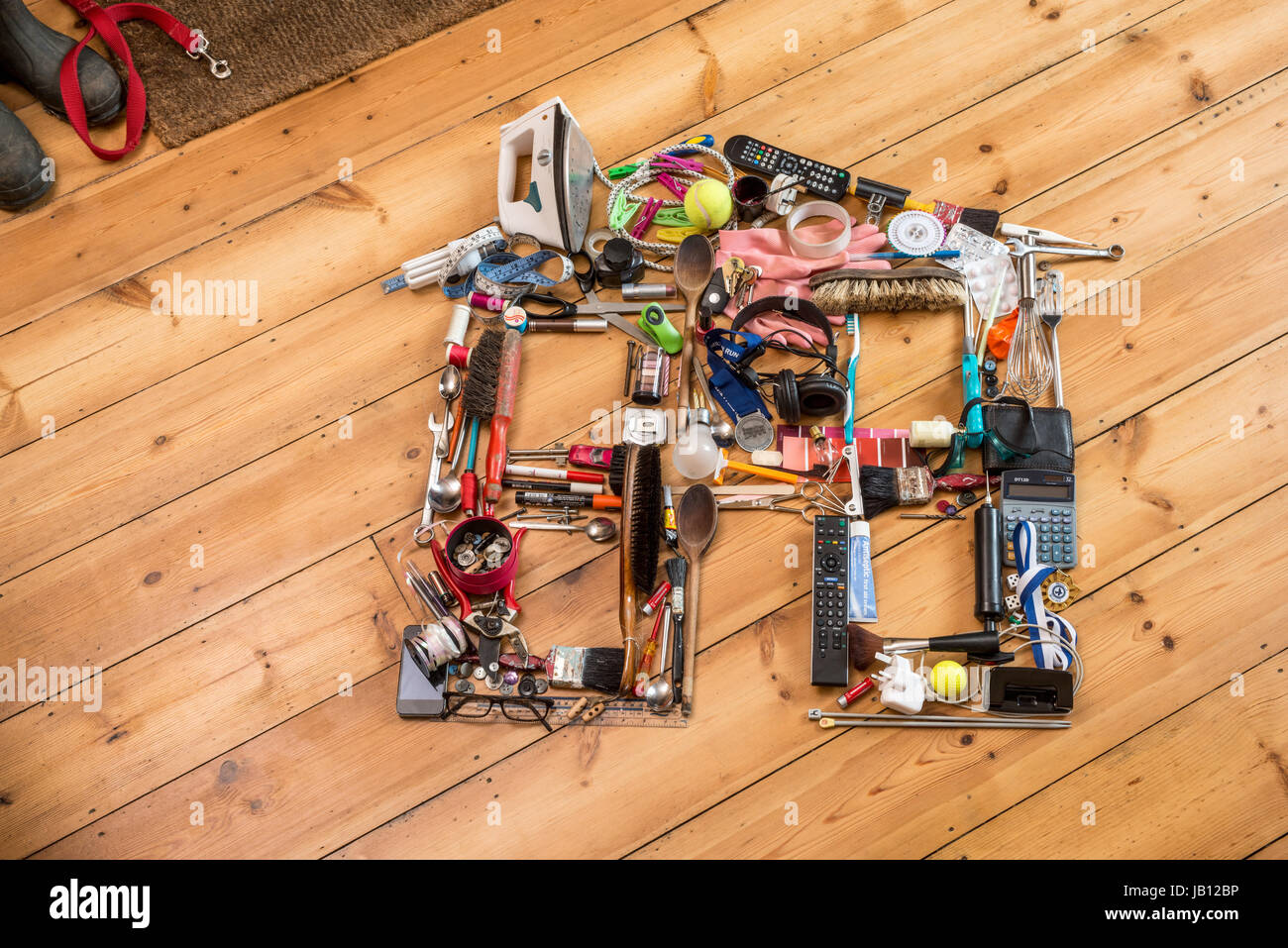 icône de maison faite à partir d'objets ménagers Banque D'Images