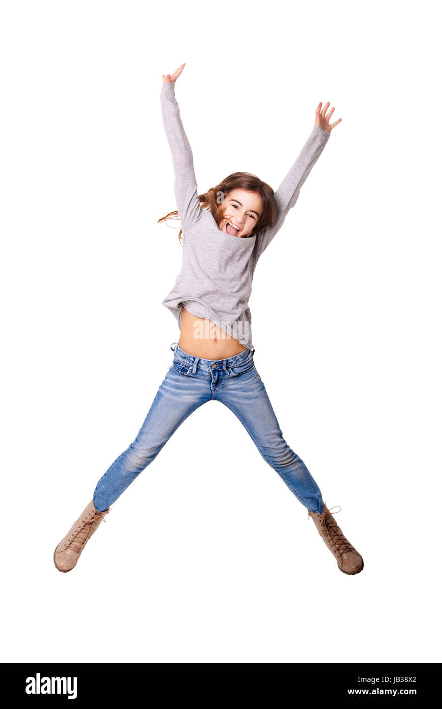 Little girl jumping over a white background Banque D'Images