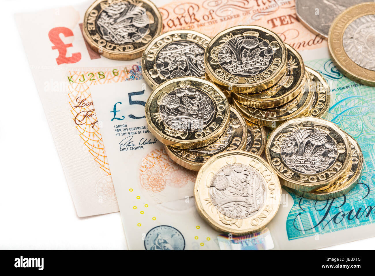 Une livre britannique de pièces sur les billets de banque britannique Banque D'Images